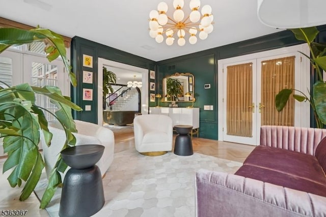 34 Oak Bend Rd, West Orange Twp, NJ 07052 - living room featuring a chandelier, french doors, and stairs