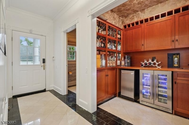34 Oak Bend Rd, West Orange Twp, NJ 07052 - indoor dry bar featuring wine cooler, ornamental molding, plenty of natural light, refrigerator, and inlaid floor details