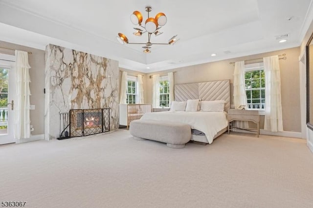 34 Oak Bend Rd, West Orange Twp, NJ 07052 - carpeted bedroom with a tray ceiling, a chandelier, multiple windows, access to exterior, and crown molding