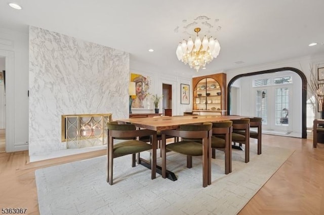 34 Oak Bend Rd, West Orange Twp, NJ 07052 - dining room with arched walkways, recessed lighting, and a chandelier