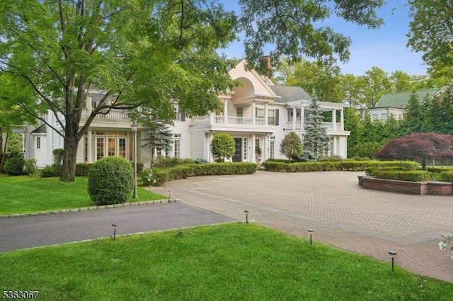 34 Oak Bend Rd, West Orange Twp, NJ 07052 - view of front of home featuring a front yard, driveway, and a chimney