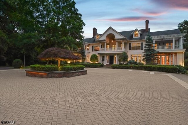34 Oak Bend Rd, West Orange Twp, NJ 07052 - view of front of house with a balcony and a chimney