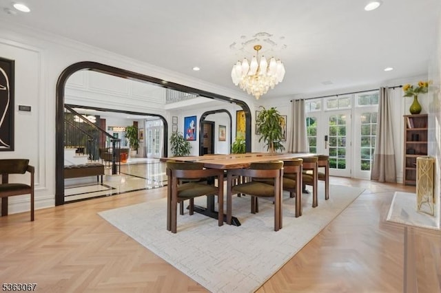 34 Oak Bend Rd, West Orange Twp, NJ 07052 - dining room with arched walkways, recessed lighting, crown molding, a chandelier, and stairs