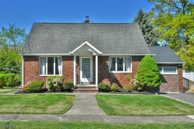 11-06 Marshall Rd, Fair Lawn Boro, NJ 07410 - view of front of house featuring brick siding, a front yard, roof with shingles, and a chimney