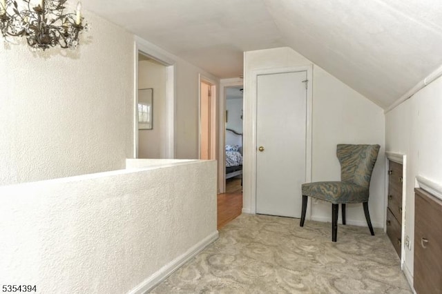 11-06 Marshall Rd, Fair Lawn Boro, NJ 07410 - living area featuring carpet, vaulted ceiling, a textured wall, and a chandelier