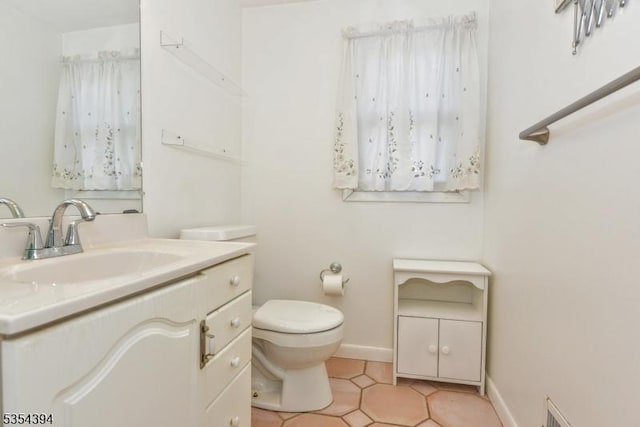 11-06 Marshall Rd, Fair Lawn Boro, NJ 07410 - bathroom with vanity, toilet, baseboards, and tile patterned floors