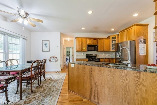 42 Stephens Mill Rd, Mount Olive Twp, NJ 07840 - kitchen featuring black appliances, brown cabinets, dark stone countertops, a sink, and recessed lighting
