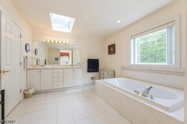 42 Stephens Mill Rd, Mount Olive Twp, NJ 07840 - bathroom featuring a skylight, plenty of natural light, double vanity, and a bath
