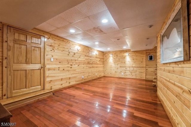 42 Stephens Mill Rd, Mount Olive Twp, NJ 07840 - unfurnished room featuring hardwood / wood-style flooring, wood walls, a drop ceiling, and recessed lighting