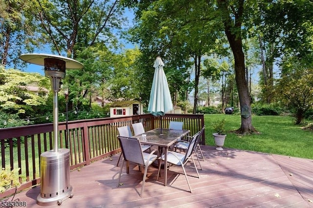 970 Cedar Dr, Stillwater Twp, NJ 07860 - deck featuring outdoor dining area, a yard, and view of wooded area