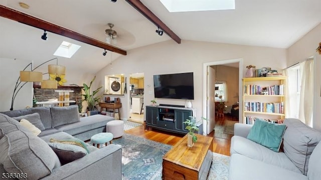 970 Cedar Dr, Stillwater Twp, NJ 07860 - living room with a skylight, wood finished floors, rail lighting, and a ceiling fan
