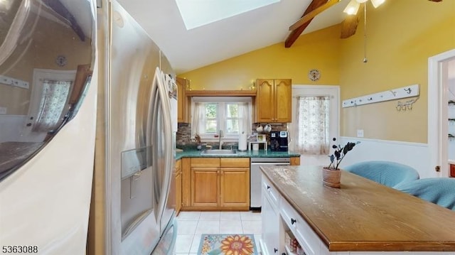 970 Cedar Dr, Stillwater Twp, NJ 07860 - kitchen featuring stainless steel appliances, a sink, a skylight, dark countertops, and vaulted ceiling
