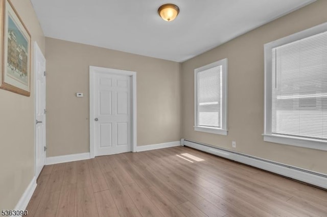 451 Centre St, Nutley Twp, NJ 07110 - unfurnished room with baseboard heating, light wood-type flooring, and baseboards