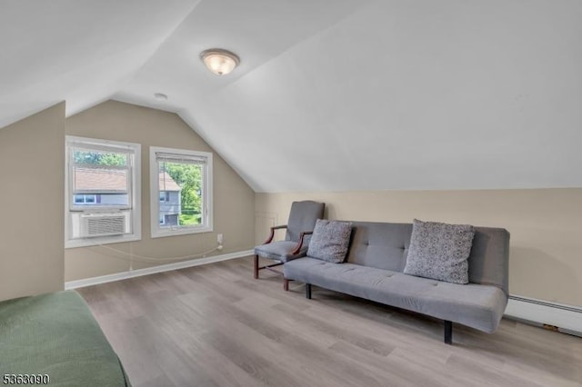 451 Centre St, Nutley Twp, NJ 07110 - sitting room featuring wood finished floors, lofted ceiling, cooling unit, baseboards, and a baseboard radiator