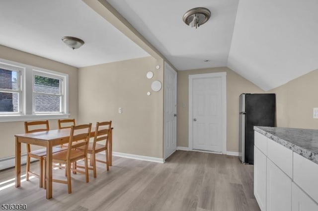 451 Centre St, Nutley Twp, NJ 07110 - dining area featuring light wood finished floors, baseboards, and lofted ceiling