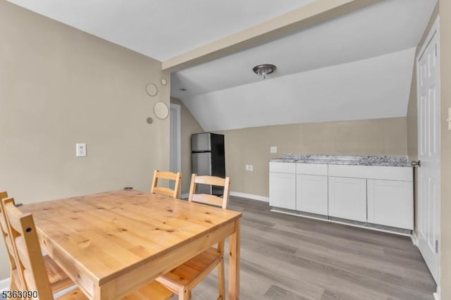 451 Centre St, Nutley Twp, NJ 07110 - dining space with lofted ceiling and light wood-type flooring