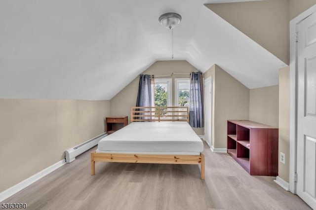 451 Centre St, Nutley Twp, NJ 07110 - bedroom featuring baseboard heating, wood finished floors, baseboards, and vaulted ceiling