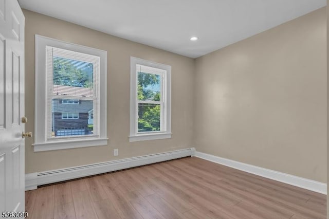 451 Centre St, Nutley Twp, NJ 07110 - empty room with a baseboard radiator, light wood-style flooring, baseboards, and recessed lighting
