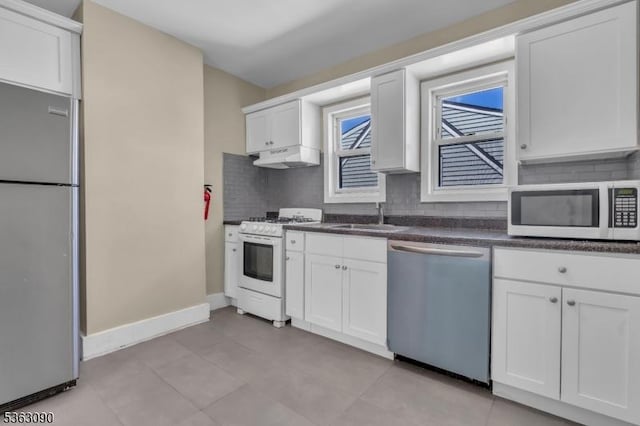 451 Centre St, Nutley Twp, NJ 07110 - kitchen featuring stainless steel appliances, tasteful backsplash, baseboards, white cabinets, and a sink