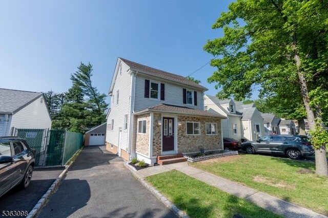 1250 Wildwood Ter, Union Twp, NJ 07083 - view of front of property with a detached garage, stone siding, and an outdoor structure