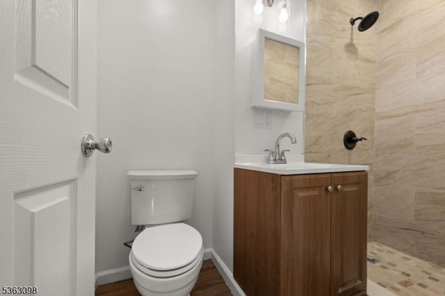 1250 Wildwood Ter, Union Twp, NJ 07083 - bathroom featuring vanity, tiled shower, and wood finished floors
