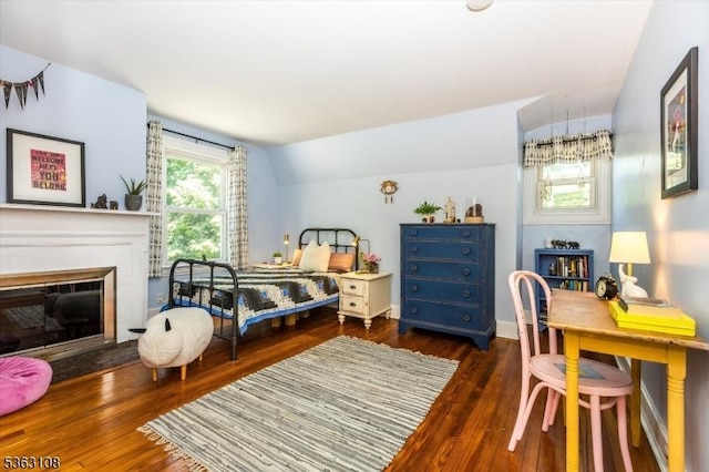 1 Walden Pl, Montclair Twp, NJ 07042 - bedroom featuring wood finished floors, a glass covered fireplace, and vaulted ceiling