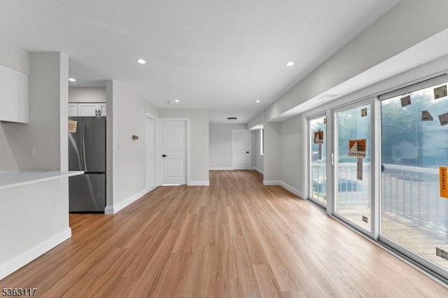 20 Beaconsfield Pl, Franklin Twp, NJ 08873 - unfurnished living room featuring light wood-type flooring, baseboards, and recessed lighting