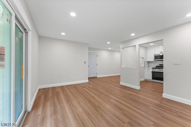 35 Amethyst Way, Franklin Twp, NJ 08823 - unfurnished living room with light wood-style flooring, baseboards, and recessed lighting