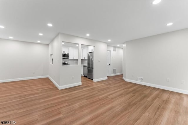 35 Amethyst Way, Franklin Twp, NJ 08823 - unfurnished living room featuring light wood-style flooring, baseboards, and recessed lighting