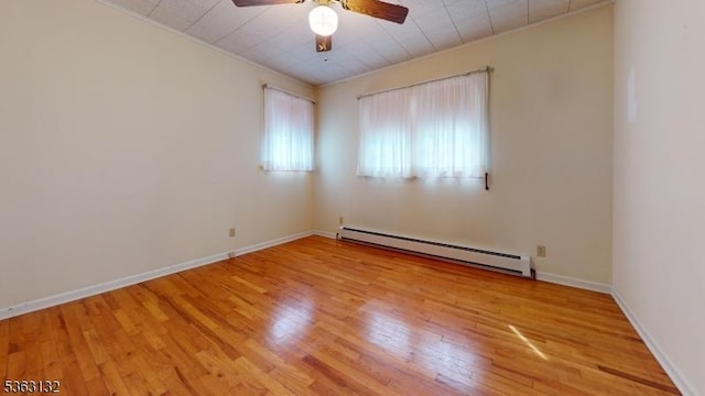2039 Church Ave, Scotch Plains Twp, NJ 07076 - empty room with a baseboard heating unit, ceiling fan, wood finished floors, crown molding, and baseboards