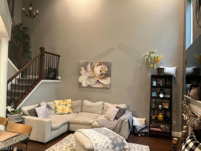 64 Pond Hollow Dr, Jefferson Twp, NJ 07438 - living area with wood finished floors, a chandelier, stairs, and decorative columns