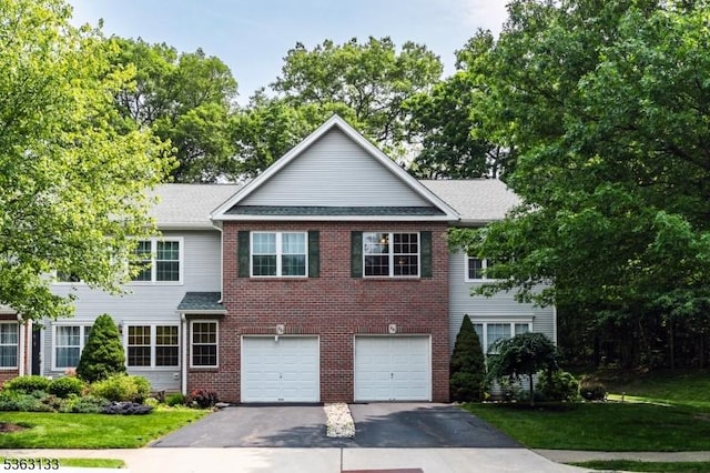 64 Pond Hollow Dr, Jefferson Twp, NJ 07438 - view of front of home with asphalt driveway, an attached garage, brick siding, and a shingled roof