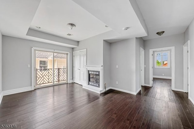 69 Summit Rd, Elizabeth City, NJ 07208 - unfurnished living room featuring baseboards, dark wood-type flooring, and a glass covered fireplace