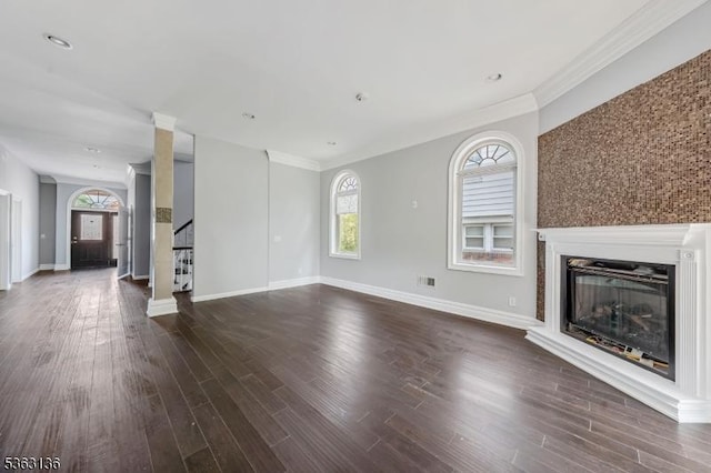 69 Summit Rd, Elizabeth City, NJ 07208 - unfurnished living room with plenty of natural light, stairs, dark wood finished floors, and crown molding