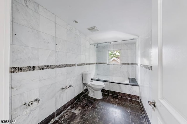69 Summit Rd, Elizabeth City, NJ 07208 - full bath with tiled shower / bath combo, toilet, and tile walls