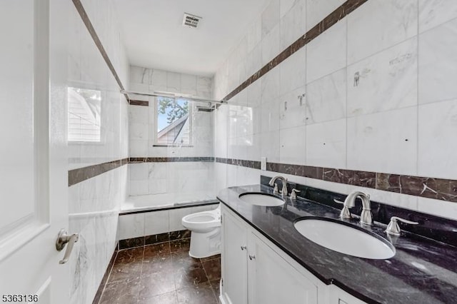69 Summit Rd, Elizabeth City, NJ 07208 - bathroom featuring tiled shower / bath, tile walls, toilet, and double vanity