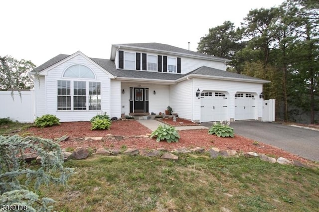 132 Sloop Rd, Stafford Twp, NJ 08050 - traditional-style home with a garage and asphalt driveway