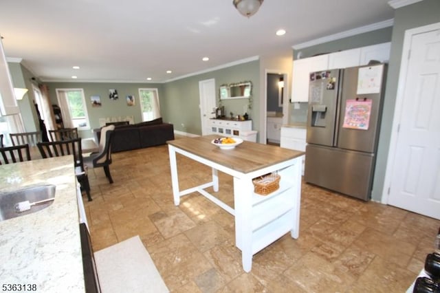 132 Sloop Rd, Stafford Twp, NJ 08050 - kitchen featuring stainless steel fridge, crown molding, white cabinets, recessed lighting, and light stone countertops