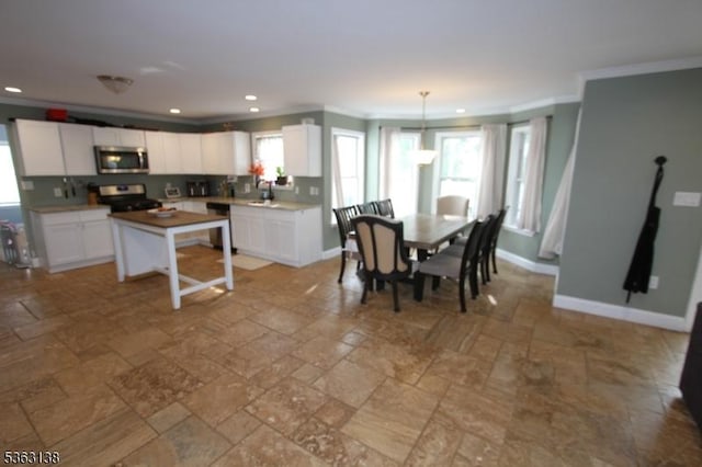 132 Sloop Rd, Stafford Twp, NJ 08050 - dining room with ornamental molding, stone tile floors, recessed lighting, and baseboards