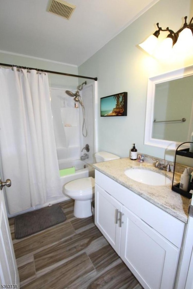 132 Sloop Rd, Stafford Twp, NJ 08050 - bathroom with vanity, shower / tub combo, toilet, and wood finished floors