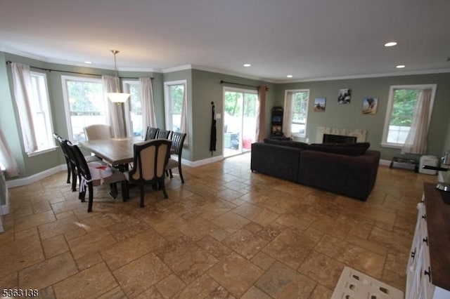 132 Sloop Rd, Stafford Twp, NJ 08050 - dining area featuring stone tile flooring, ornamental molding, recessed lighting, plenty of natural light, and baseboards