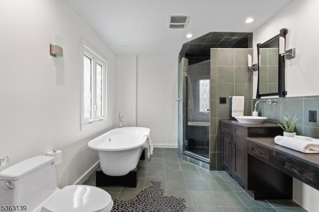 460 Overhill Rd, South Orange Village Twp, NJ 07079 - full bath with vanity, a stall shower, a soaking tub, toilet, and tile patterned floors