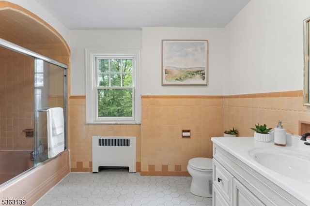460 Overhill Rd, South Orange Village Twp, NJ 07079 - bathroom with radiator, tile walls, vanity, toilet, and wainscoting