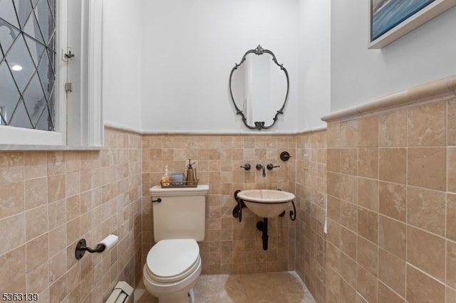 460 Overhill Rd, South Orange Village Twp, NJ 07079 - half bathroom with toilet, a baseboard radiator, a wainscoted wall, and tile walls