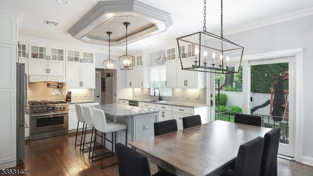 120 Cottage Pl, Westfield Town, NJ 07090 - kitchen with stainless steel appliances, a chandelier, a center island, white cabinets, and ornamental molding