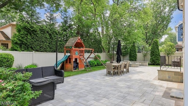 120 Cottage Pl, Westfield Town, NJ 07090 - fenced backyard featuring a patio area, outdoor dining area, an outdoor living space, and a playground