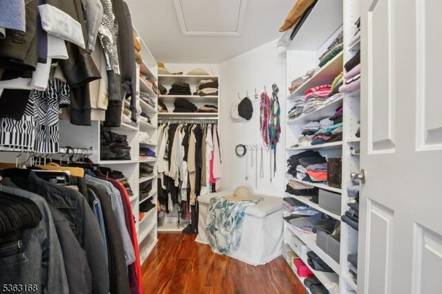 157 Rock Rd, Wayne Twp, NJ 07470 - spacious closet featuring wood finished floors and attic access