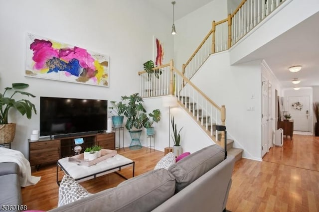 157 Rock Rd, Wayne Twp, NJ 07470 - living area featuring stairs, wood finished floors, and a high ceiling