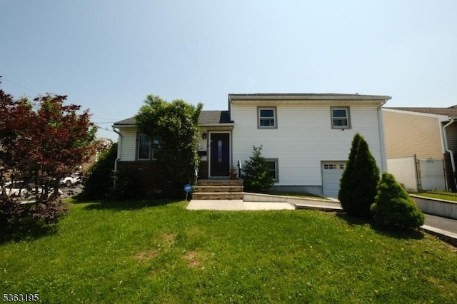 179 Standish St, Elizabeth City, NJ 07202 - split level home with a garage and a front yard