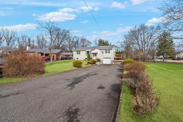 304 Lilac Ct, Bridgewater Twp, NJ 08807 - split foyer home featuring an attached garage, driveway, and a front yard